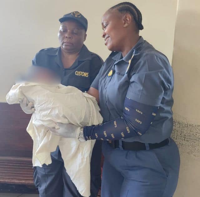 Customs official Jabu Nkuna and Sergeant Tshidi Mokoena proudly hold the newborn. Photos: Supplied/SAPS
