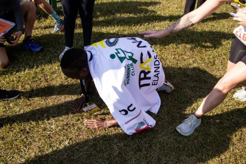 Jackson Koisenge, winner of the 2024 race, on his hands and knees after crossing the finish line. > Photos: Blake Linder