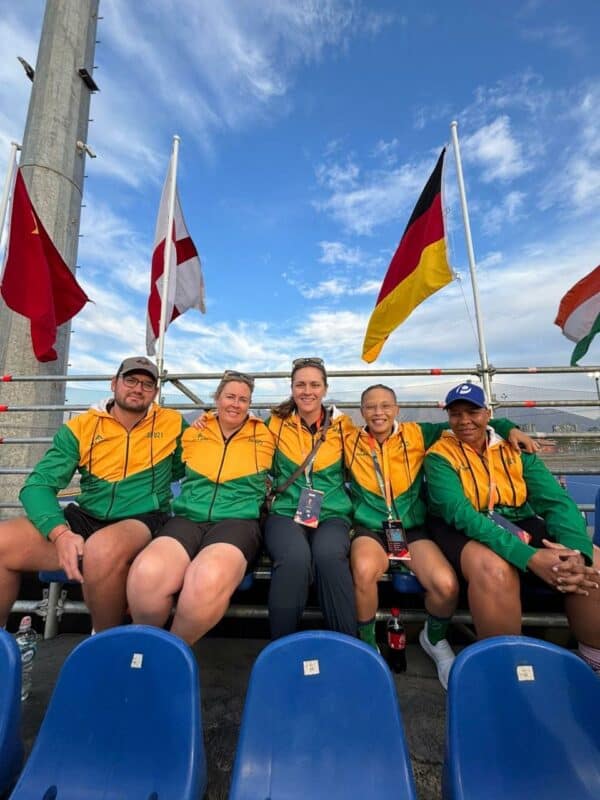 Anthony Ruschenbaum (left) with the coaching staff at the FIH Junior World Cup.