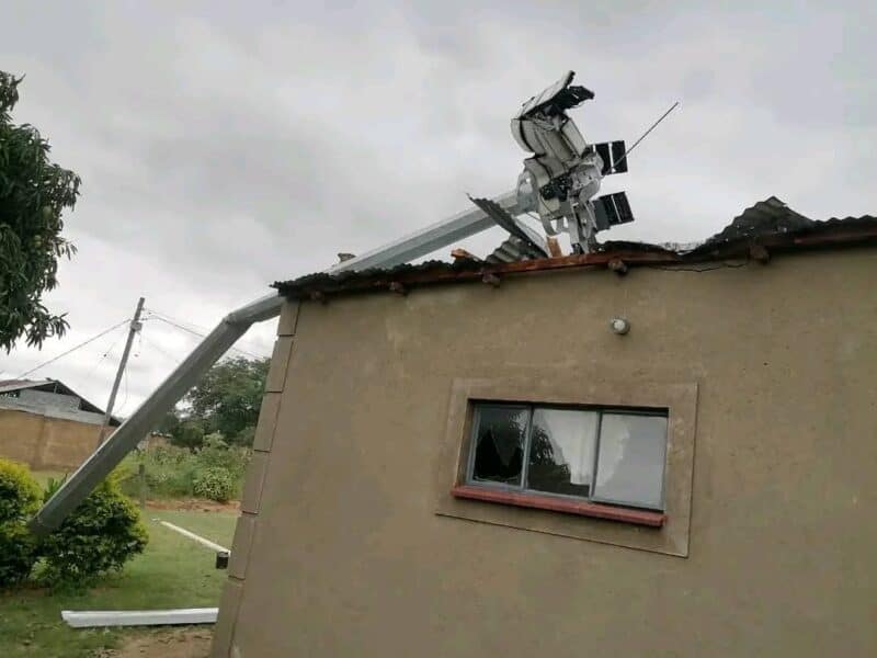 A roof crushed by a fallen streetlight.