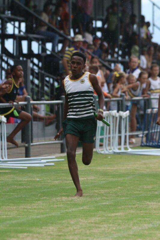 Tinyiko Sibia ran a brilliant final leg during the U13 boys relay to win gold for White River. > Photo: Blake Linder