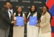 Valterra Platinum’s Tumisho Kekana (left) and Glencore’s Hangwie Rashamuse (right) hand awards to Sengange High School educators Paulina Mante and TB Malekana.