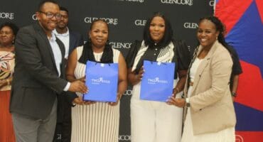 Valterra Platinum’s Tumisho Kekana (left) and Glencore’s Hangwie Rashamuse (right) hand awards to Sengange High School educators Paulina Mante and TB Malekana.