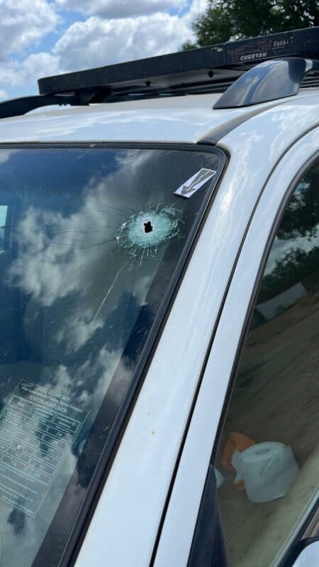 A bullet hole in the windscreen.