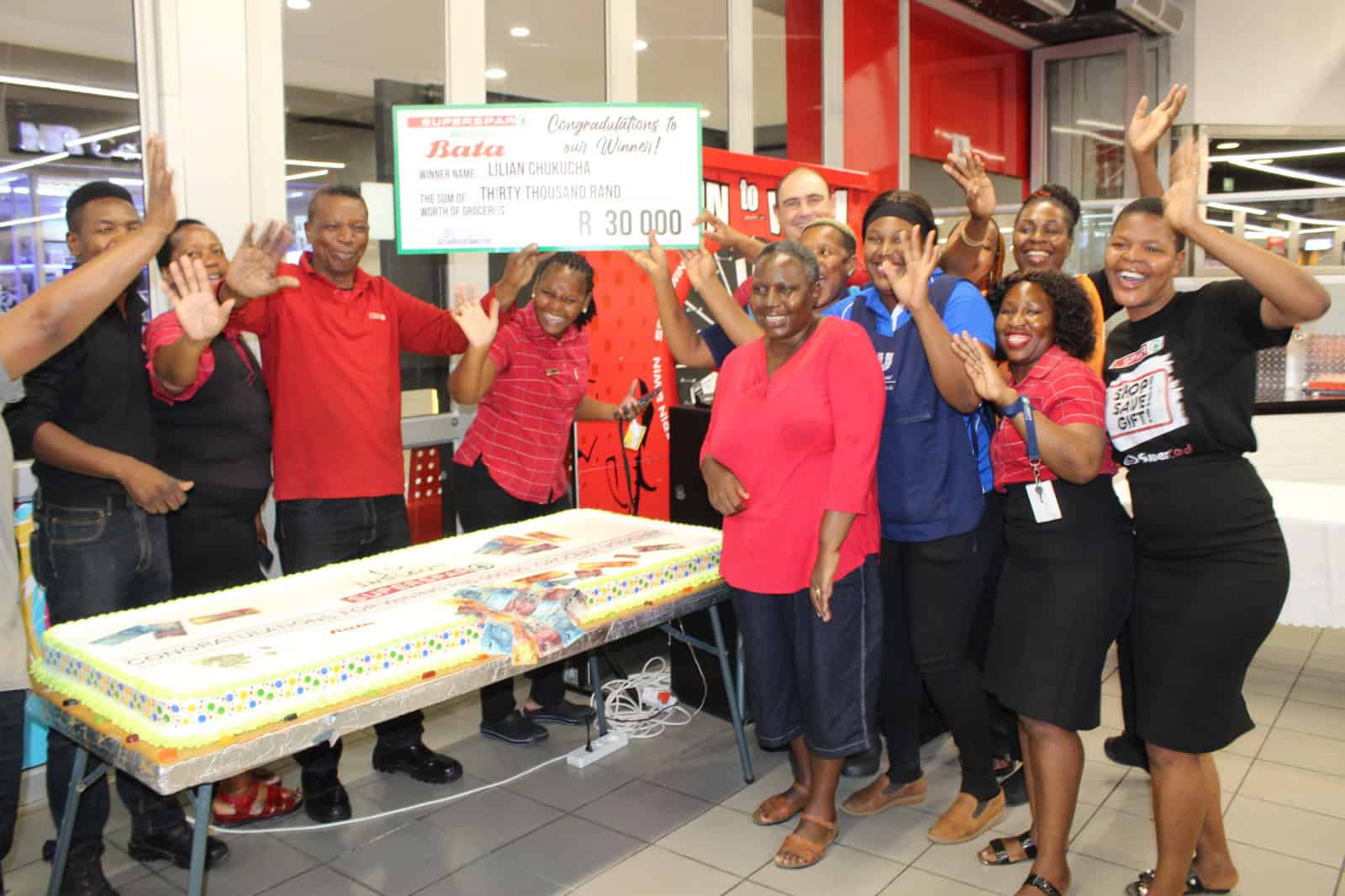 Staff at SUPERSPAR Indlovu celebrate with Lilian Chukucha.
