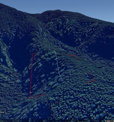 The red block shows the rugged terrain where the mine will be. The white line is the vertical drop of 103m over a distance of 305m.