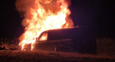 The Land Rover Defender on fire.