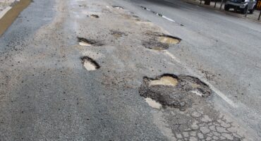 Vehicles swerve into oncoming traffic to avoid potholes on Old Pretoria Road. > Photo: Tumelo Waga Dibakwane