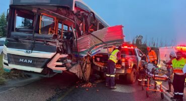 Emergency services work to extract passengers from the Buscor bus.