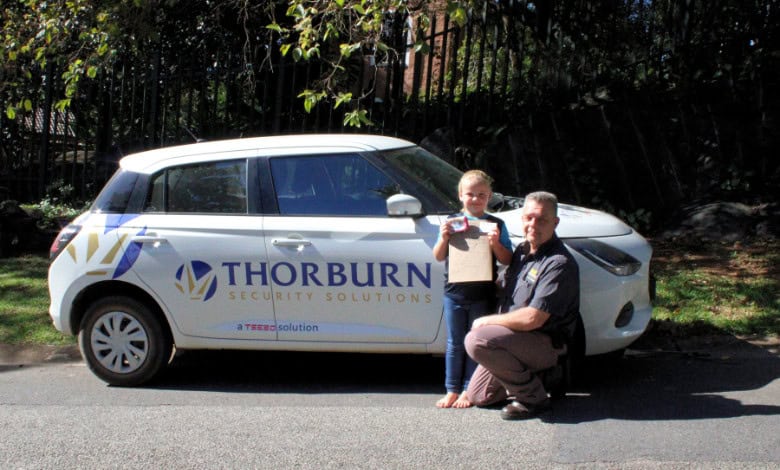 Simoné and Pieter with her statement and his Thorburn car.