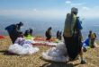 The paragliders get ready to take off. > Photo: Supplied/Coelett Delport