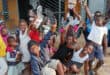 Children were happy to recieve their shoes. > Photo: Supplied/Phil Olckers