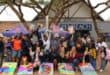 Group of children and adults celebrating at Penreach toy drive event in Mbombela.