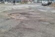 One of the potholes that was filled with soil