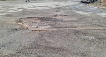 One of the potholes that was filled with soil