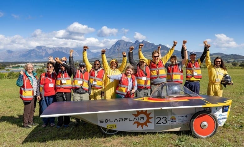 The SolarFlair team with their car after crossing the finish line. > Photo: Supplied/Sasol
