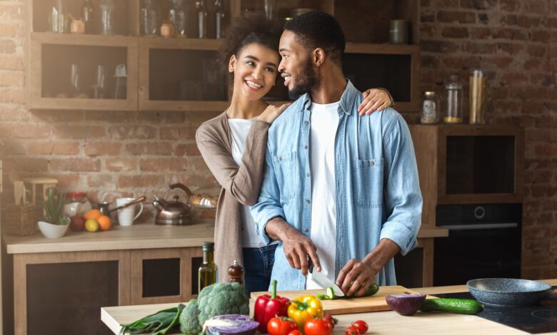 Loving,Black,Couple,Preparing,Salad,In,Loft,Kitchen,At,Home