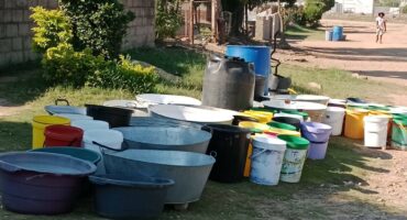 Empty containers await water tankers. > Photo: Beatrice Shongwe