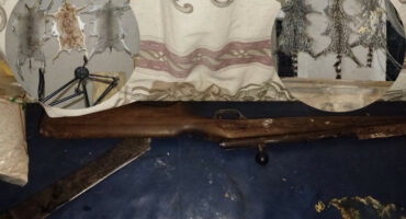 Main image: The hunting rifle that was discovered. Inserts: Wild animal skins. > Photos: Supplied/SAPS