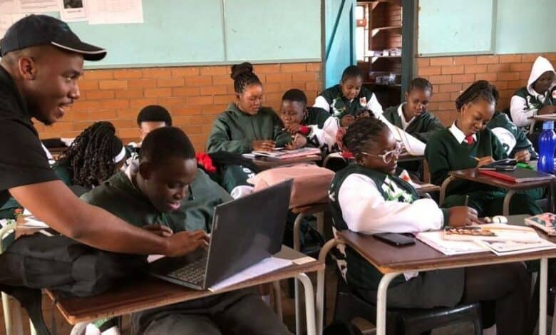 Similo Siyenga assists learners of Kaapmuiden Combined School with university applications.