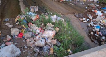 One of the illegal dumping sites near Nkambeni River.