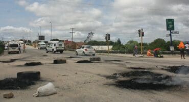 Luphisa road barricaded by burning tires during Ntlemo Projects workers’ strike in October.
