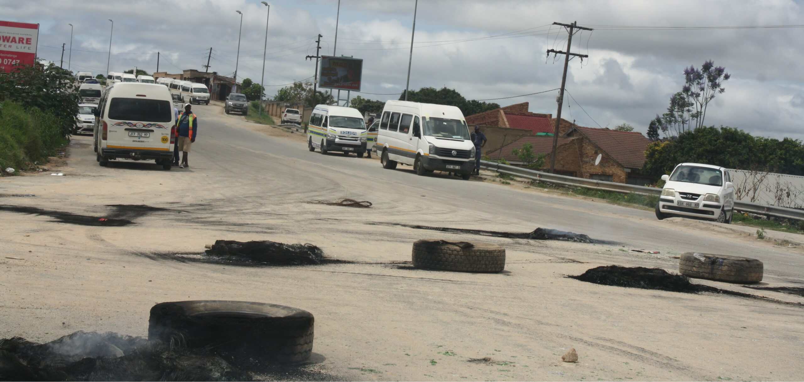 Affected D1723/Luphisa road barricaded with construction equipment and debris.