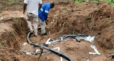 Com technician working on the faulty cable in Riverside. > Photo: Supplied