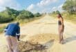 Elvis Ubisi shows Emotion Mashele how he fills a pothole. > Photo: Supplied/Emotion Mashele