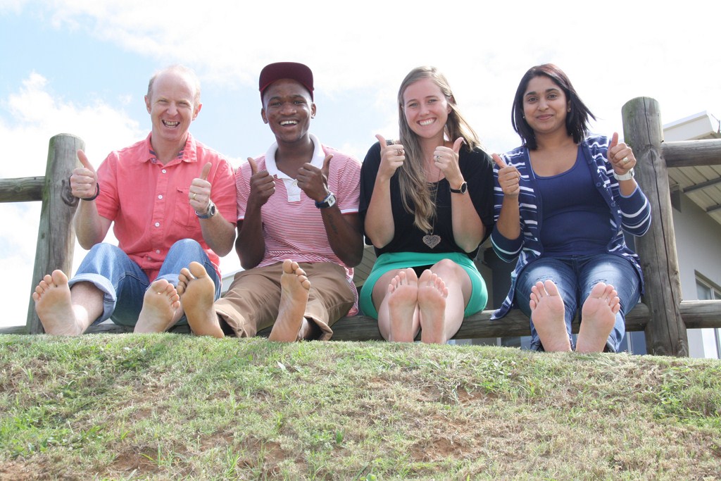 Baring their soles: Grace Aid members Dave Richter, Siya Shange, Pippa Rowney and Tina Singh urge residents to get involved in the NGO's 100m barefoot challenge.