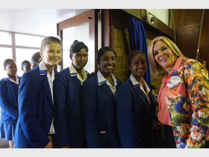 Margaret Hirsch, Chief Operations Officer of the Hirsch Group with girls from Grosvenor School.