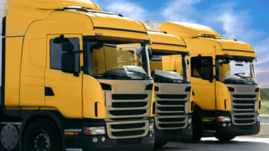 three-yellow-trucks-transporting-company_114963-1267