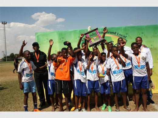 MALANDELA Mighty Heroes lift their trophy high after winning the U15 Alex football league.