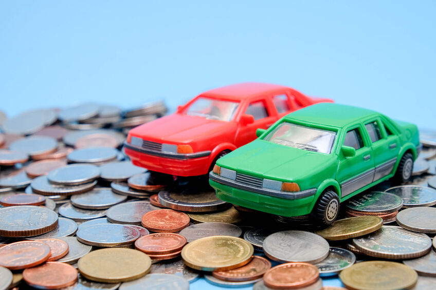 save money for investment concept Toy car and stack of coins