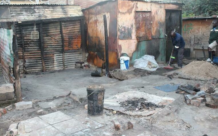 Some residents stand in the spaces where their homes once stood and try to figure out what is the next step for them. Photo: Alulutho Siboma