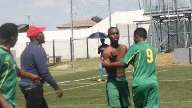 One of the feuding players of Alex Arsenal City FC is restrained by fellow teammates and technical staff. Photo: Sipho Siso