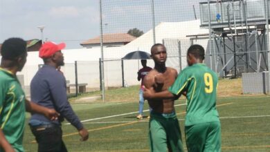 Fellow players and technical staff try to separate the fighting teammates. Photo: Sipho Siso