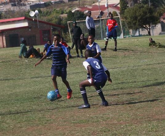 A Blue Aces defender (number 3) tries to block the passage for Linda Stars attacker as he seeks to mount a run for the goals. Photo: Sipho Siso