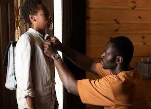 A single dad attends to his son before they leave the house for an outing.