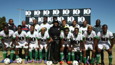 Opopo Football Club Academy team and technical staff and 10bet South Africa's Zanele Nhlapo (middle) at the kit handover. Photo: Sipho Siso