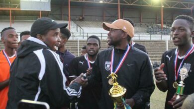 Former Dra FC coach Mosala Mafikeng (black cap) congratulates his Black Poison counterpart Wiseman 'Pepe' Nkabini (brown cap) on winning the LFA League in 2019 and gaining promotion to the Johannesburg Men's Regional League. Photo: Sipho Siso