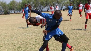 Sandown High School left winger Lebo Motlhakwana protects the ball as a Ponelopele Oracle player presses. Photo: Comfort Makhanya (Use for Print)