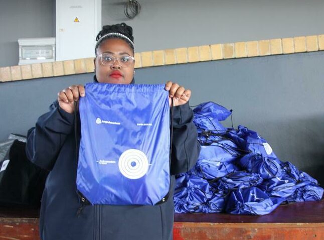 Member of the Anglo-American's Ambassadors for Good Nomalizo Dali shows off the stationery package. Photo: Sipho Siso