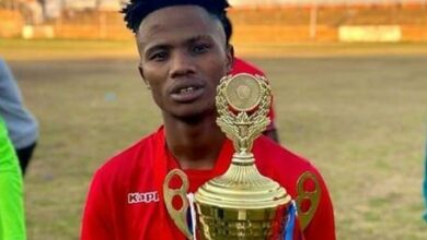 Lwando Mcosana holds the trophy that his goal-poaching prowess earned him for his Top Dogz side.