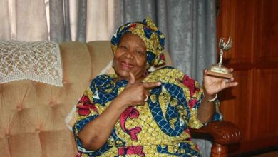 Rosina Duduzile Moropa shows off her Woman of Worth trophy she was awarded by the late Pick n Pay tycoon Raymond Ackerman. Photo: Sipho Siso