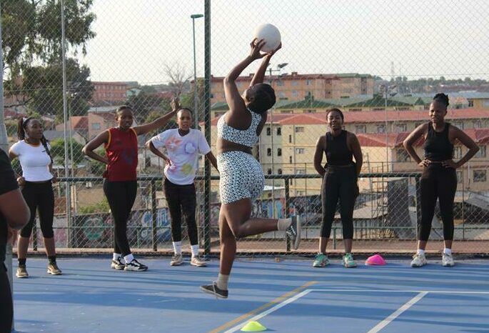 Phumzile Cele catches the ball during the training session while other netballers watch closely. Photo: Comfort Makhanya