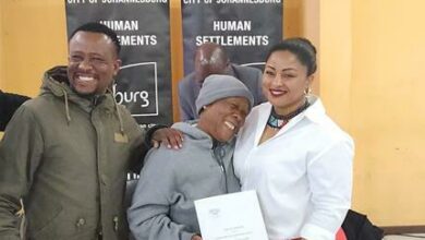 The City of Johannesburg's executive director for Human Settlements Patrick Phophi with title deed recipient and the MMC for Human Settlements Anthea Leitch.