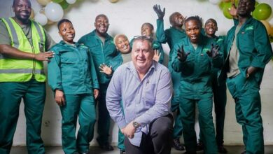 Centre manager Stephen Graetz poses for a photograph with his staff.