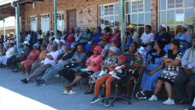 Residents at the meeting listen to councillor Tefo Raphadu as he gives feedback on the title deeds issue. Photo: Xoliswa Zakwe