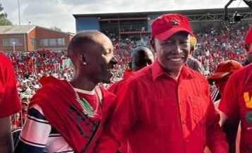 Thabiso Seduma and the EFF chairperson Julius Malema holding his portrait.